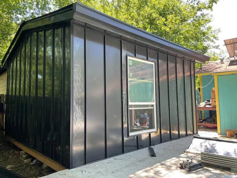 Black standing seam metal wall panels for Metal Roof Installation in Jackson